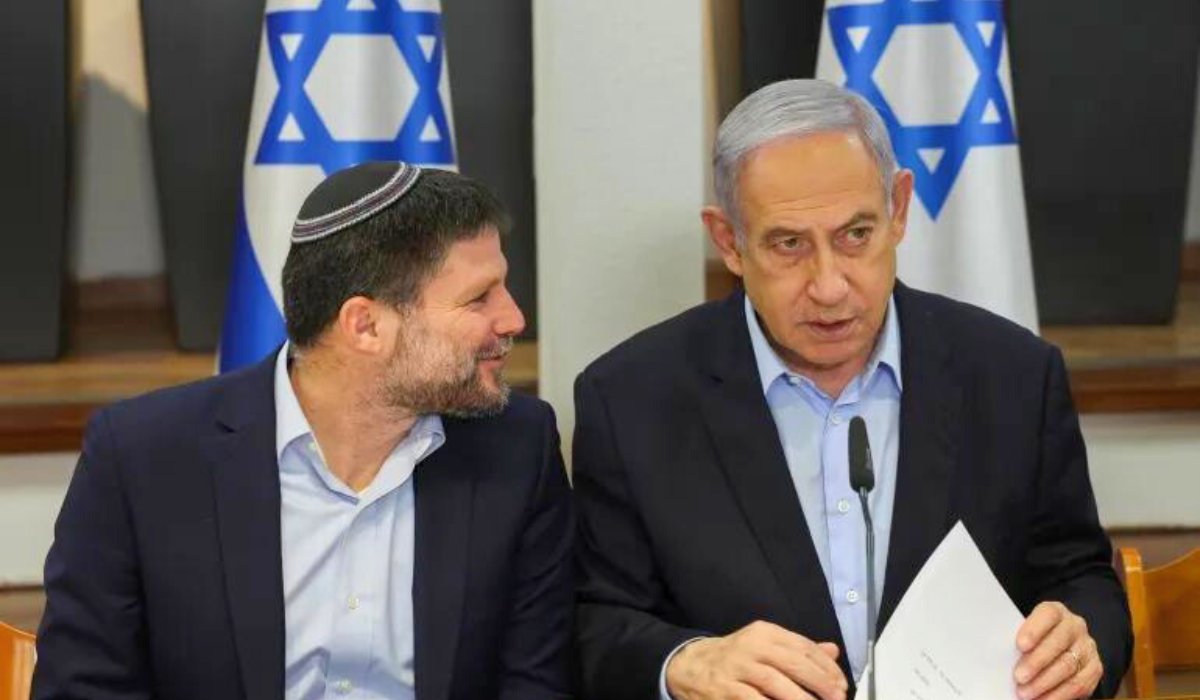 photo: Far-right Finance Minister Bezalel Smotrich, left, talks to Israeli Prime Minister Benjamin Netanyahu